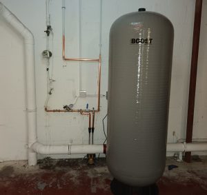 A photo of a booster storage tank in the cellar of a local coffee shop.